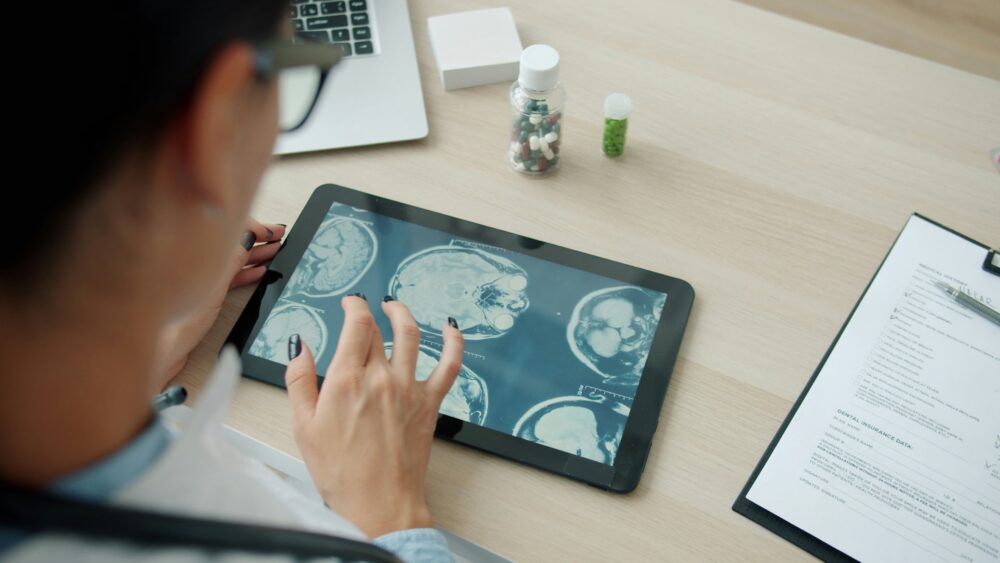 medical doctor works with tablet